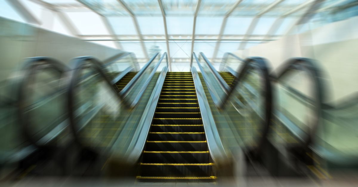 Image: a blurry escalator