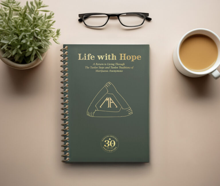 Green cover of anniversary edition of Life with Hope book with coffee and a plant