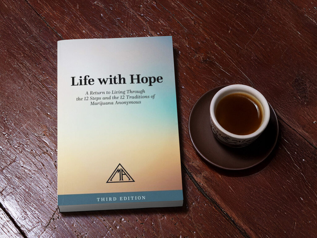 Book on a wood table with coffee
