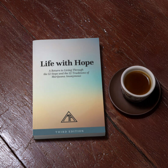 Book on a wood table with coffee