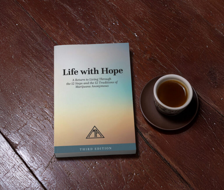 Book on a wood table with coffee
