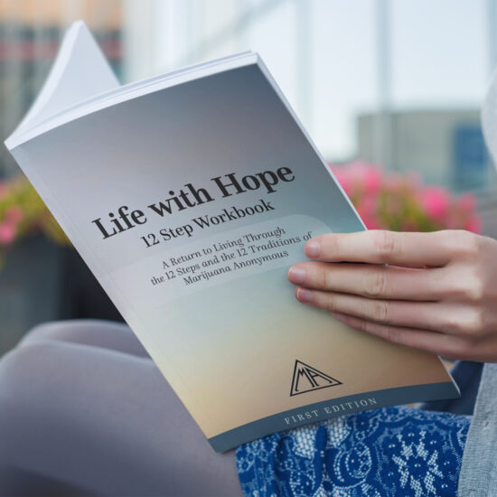 hands opening a copy of a workbook
