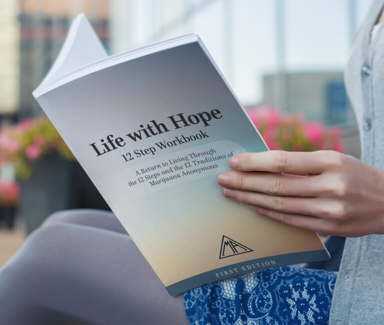 hands opening a copy of a workbook