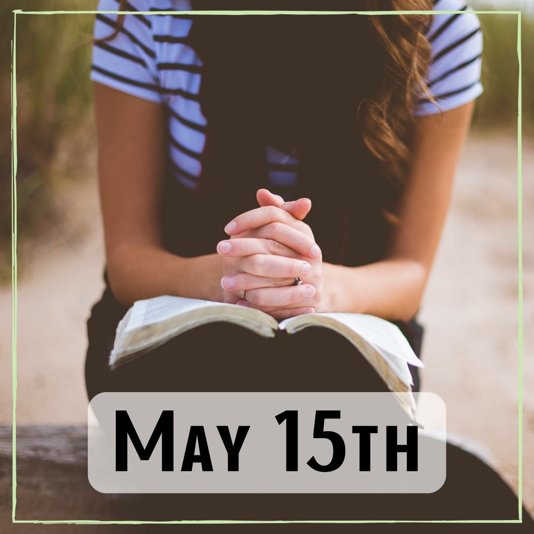 May 15th - a person with their hands crossed over a book in their lap