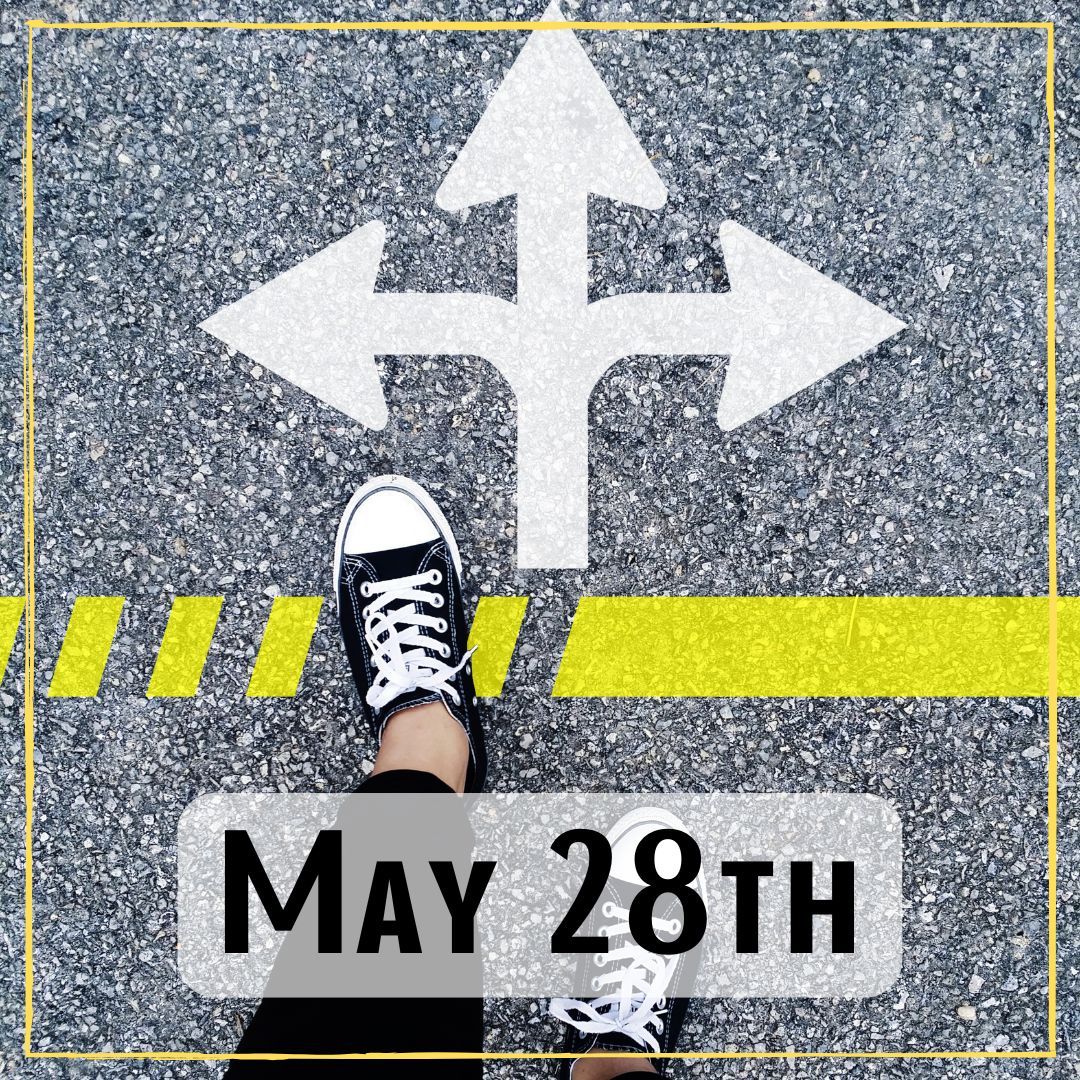 May 28th - a photo of looking down at a someone's feet standing on a painted street sign with an arrow that points left, straight, and right.