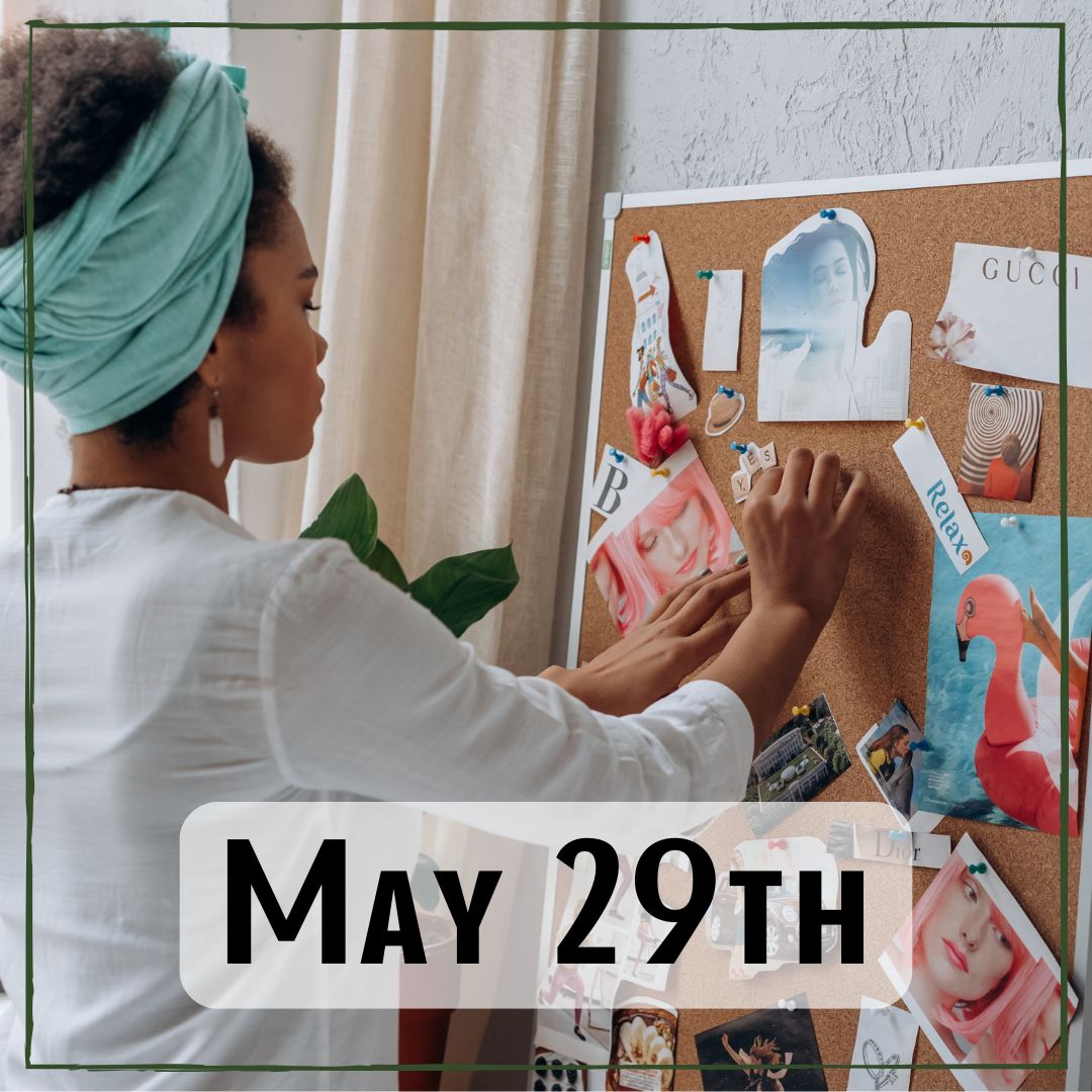 May 29th - a person pinning things on to a vision board