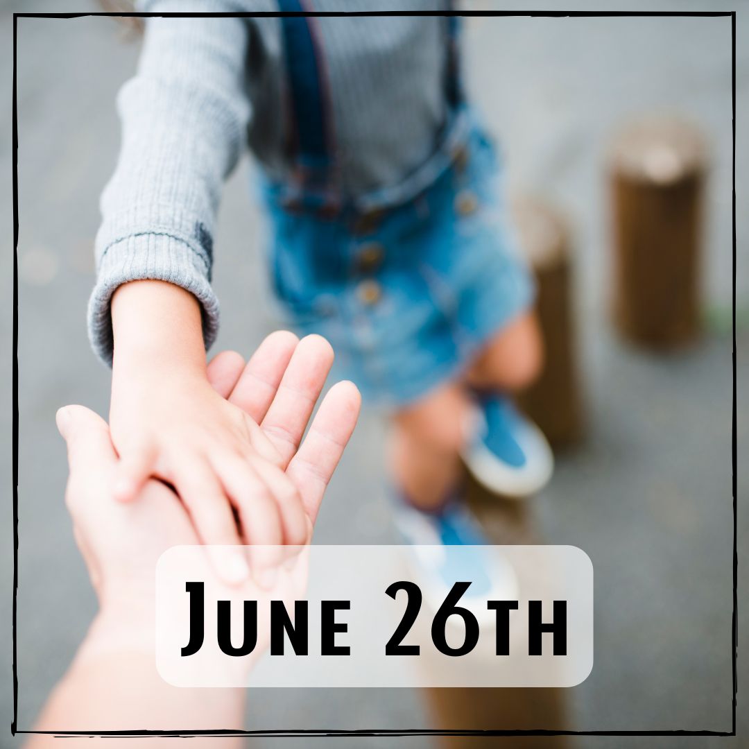 June 26th - a person holding their child's hand at a playground