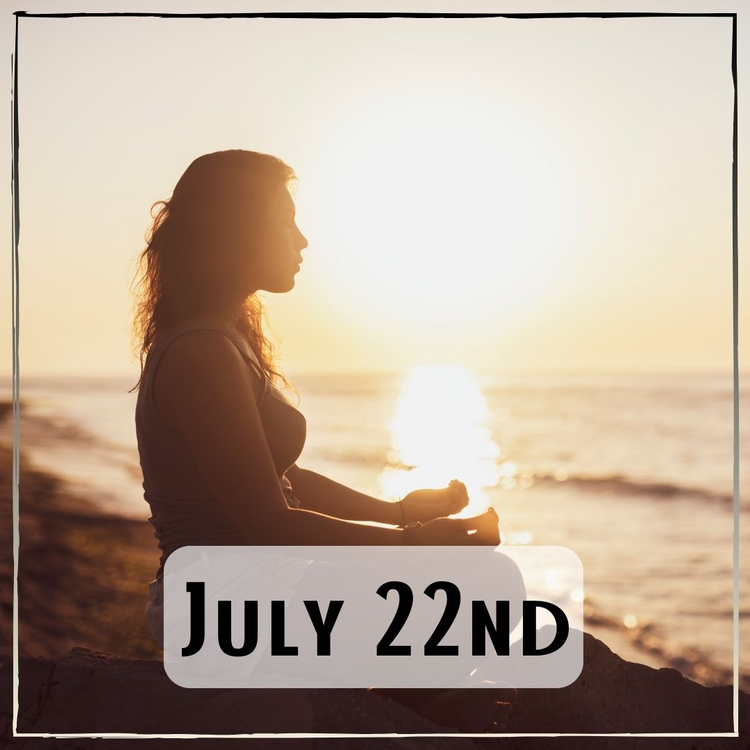 July 22nd - the profile of a person sitting and meditating by the ocean at sunrise