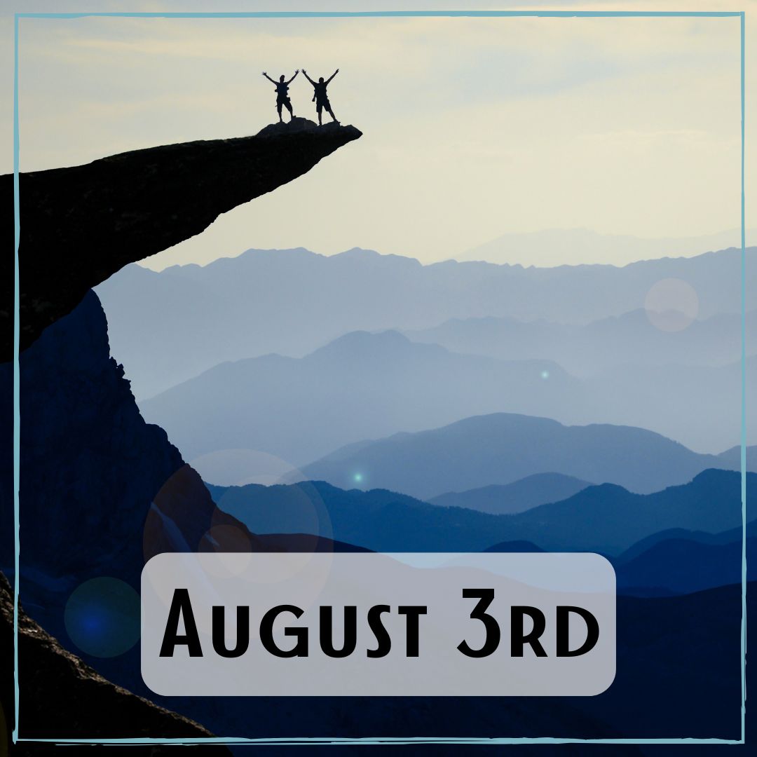 August 3rd - two people standing out on a rock ledge posing with their arms up