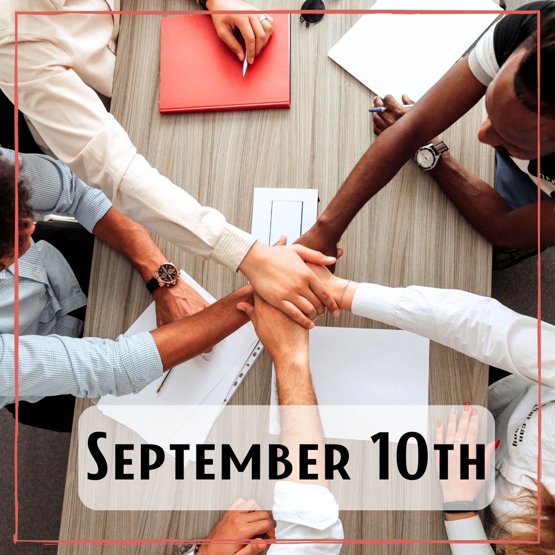 September 10th - a circle of people with their hands meeting at the center of a meeting table