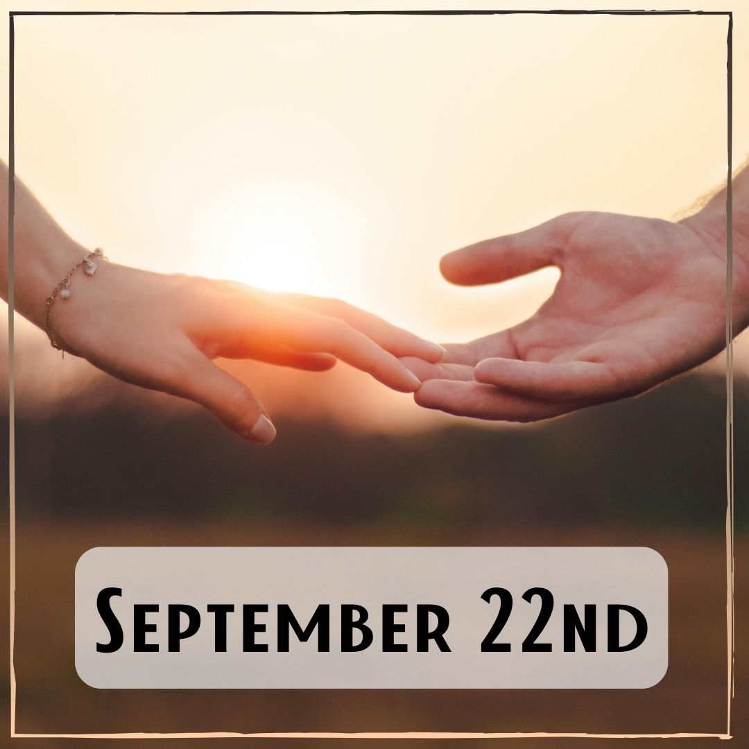 September 22nd - two hands reaching out to each other with a sunrise in the background