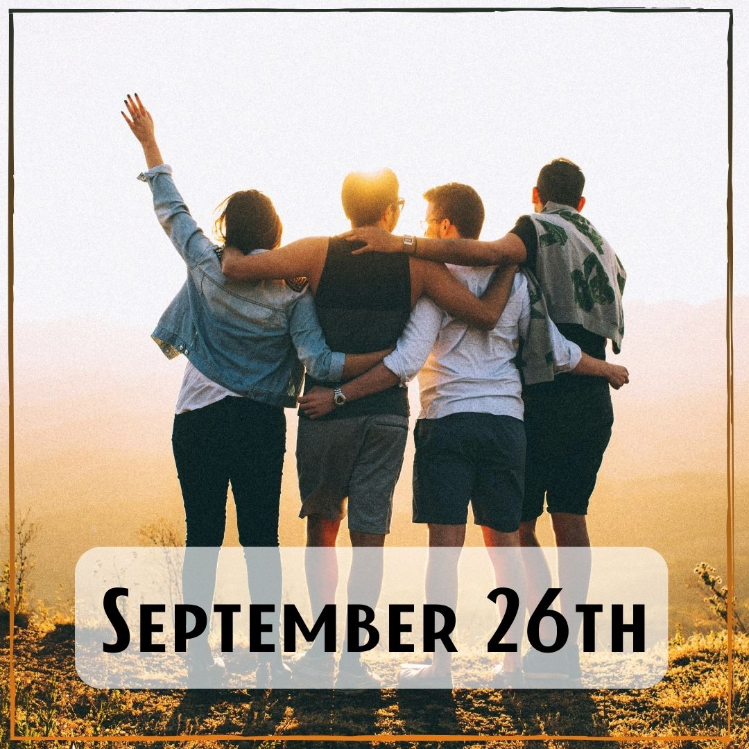September 26th - four people with their arms around each other looking out at the sunrise