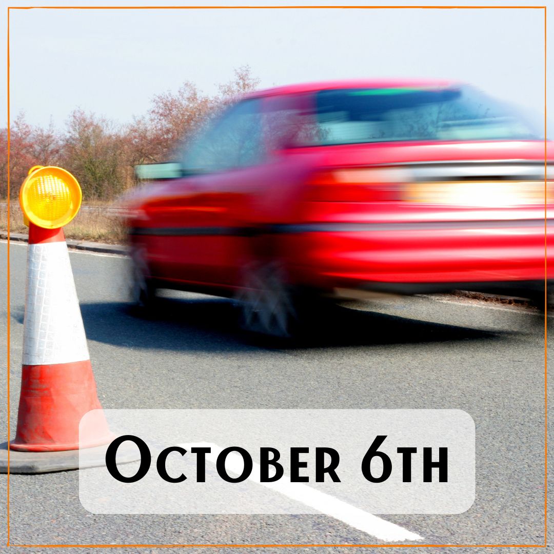 October 6th - a blurry red car speeding past a traffic safety cone