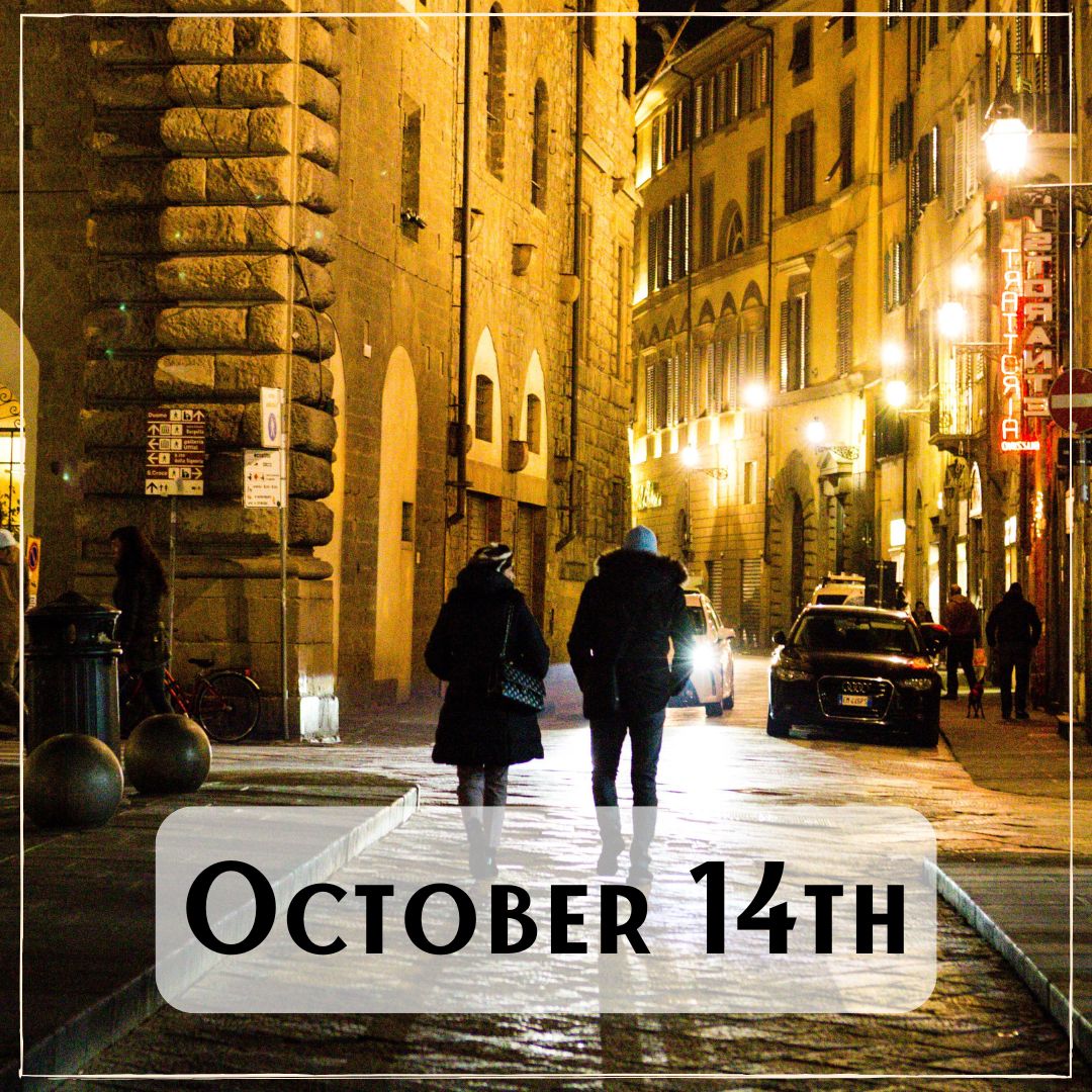 October 14th - two people walking through a city at night
