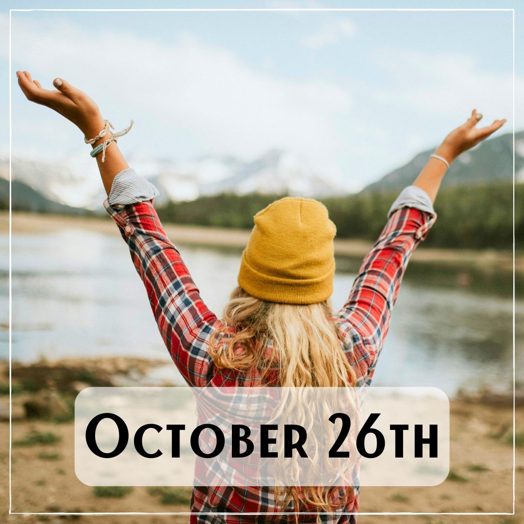 October 26th - a person looking out at a lake with their arms outstreached