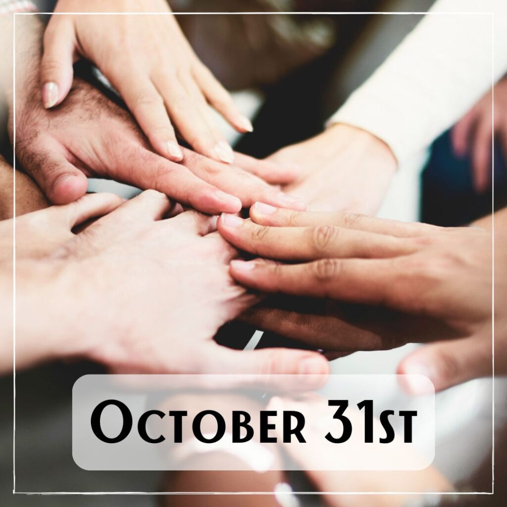 October 31st - multiple people with their hands all touching in the center