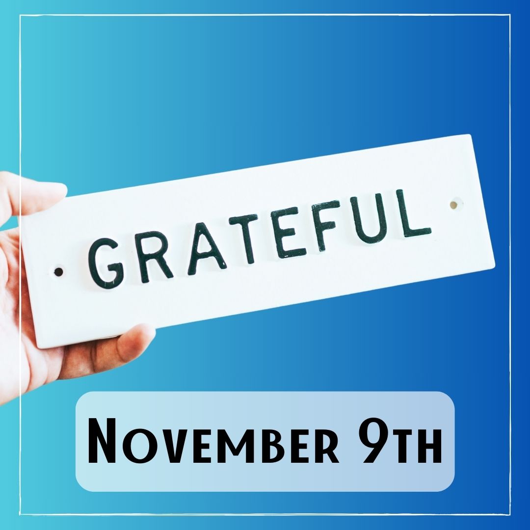 November 9th - a hand holding a sign with the word "Grateful"
