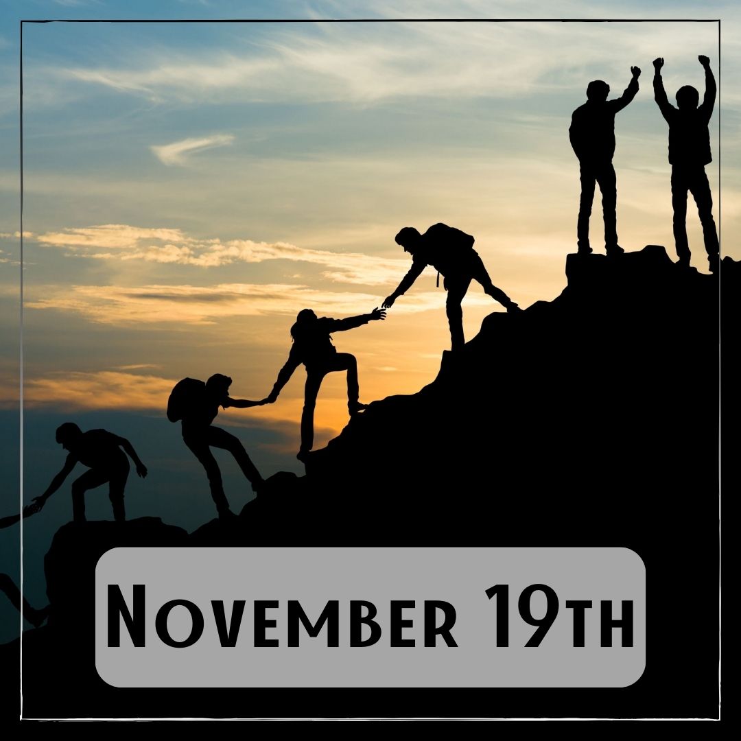 November 19th - a group of people helping each other to reach the top of a mountain.