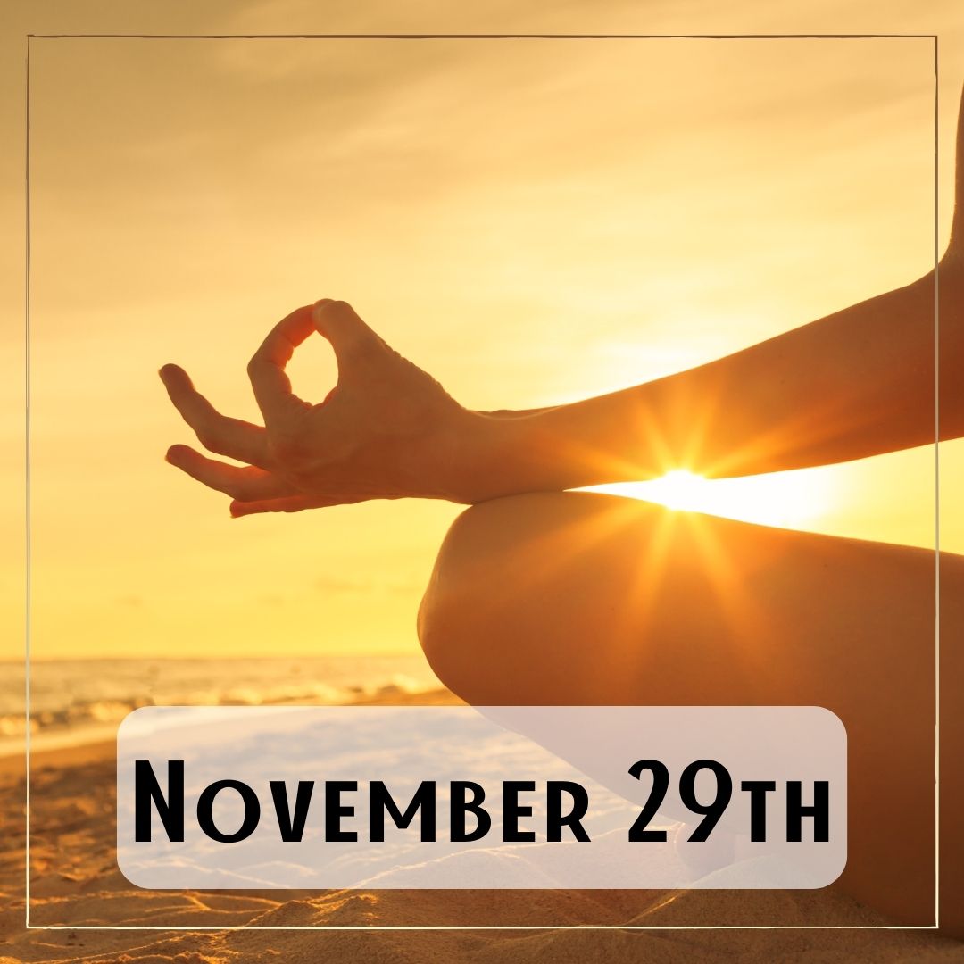 November 29th - a person's knee with their hand in a meditative position, the sunlight streams through
