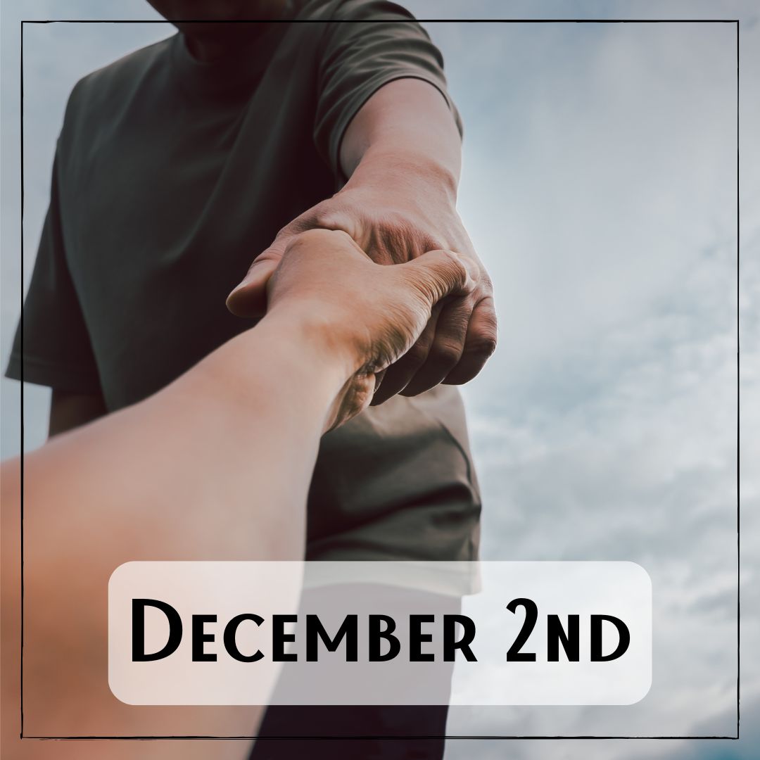 December 2nd - a person reaching their hand down to another person as if helping them stand up