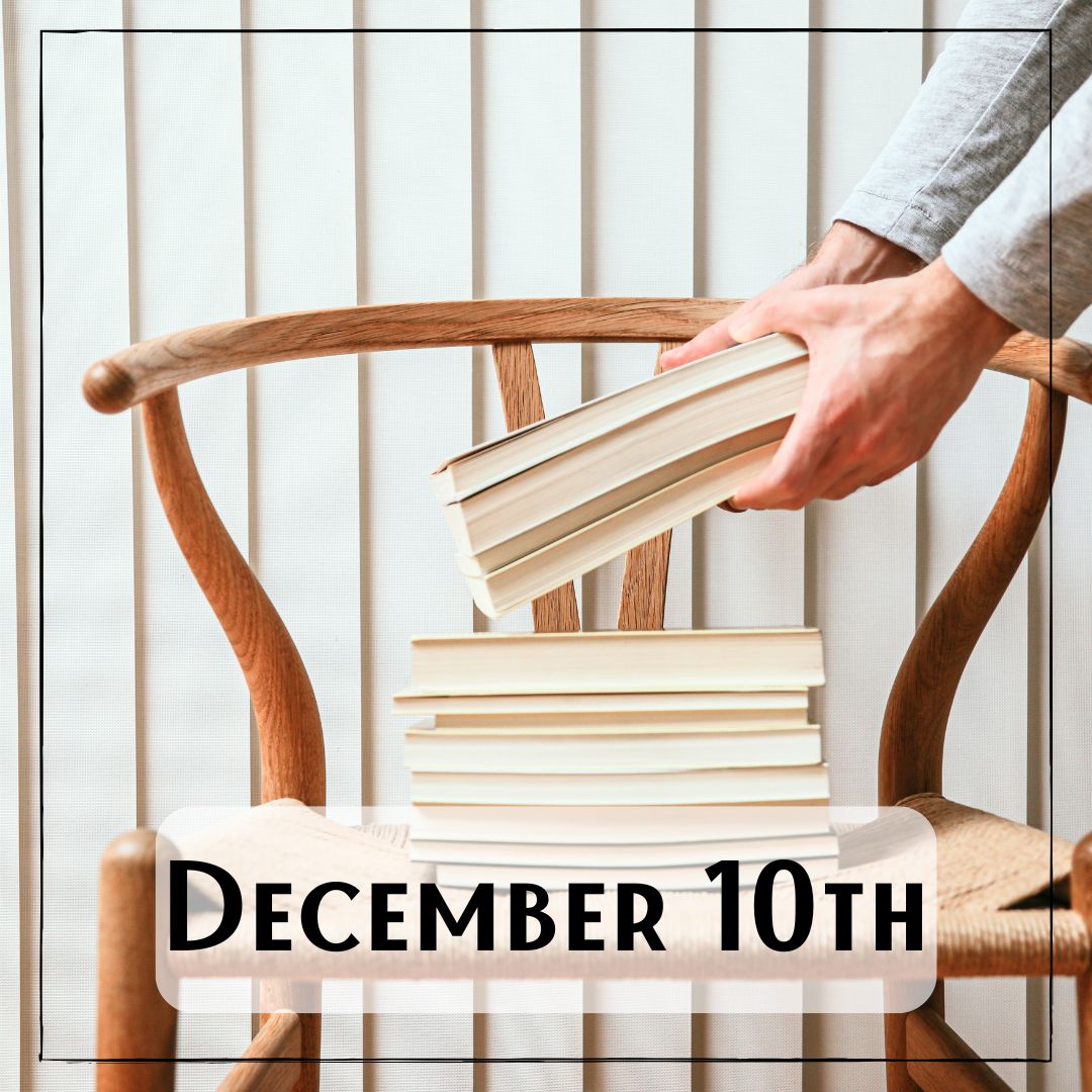 December 10th - a chair with a stack of books, and a person's hands placing more books on to the stack
