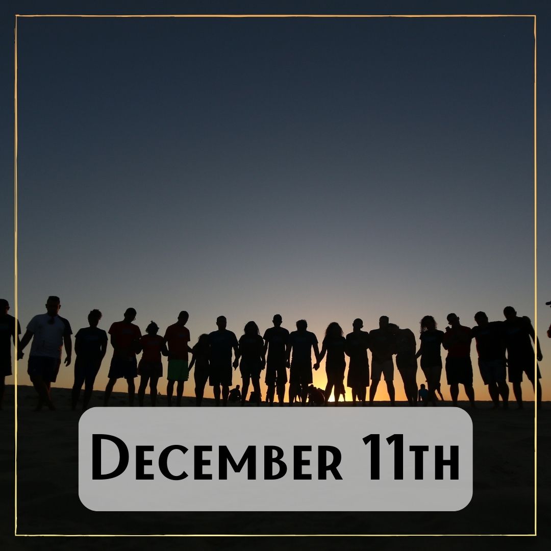 December 11th - a sunrise lights up behind a long line of people standing on a mountain ridge