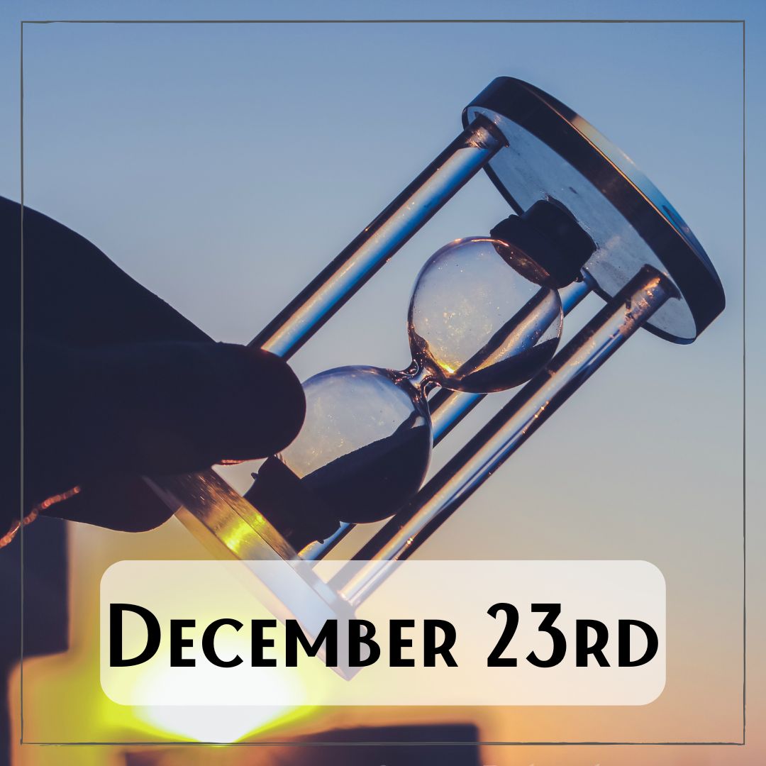 December 23rd - a sunrise background with a person holding a sand timer