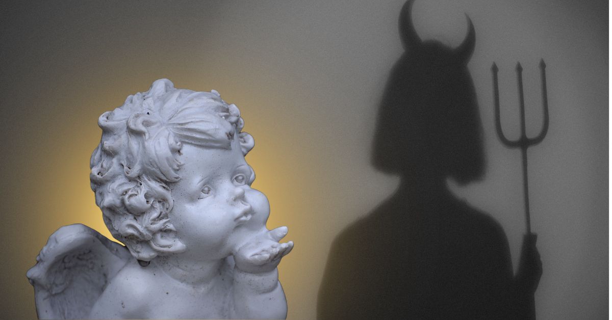 a cherub angel with a glowy halo, and the shadow of a devilish figure