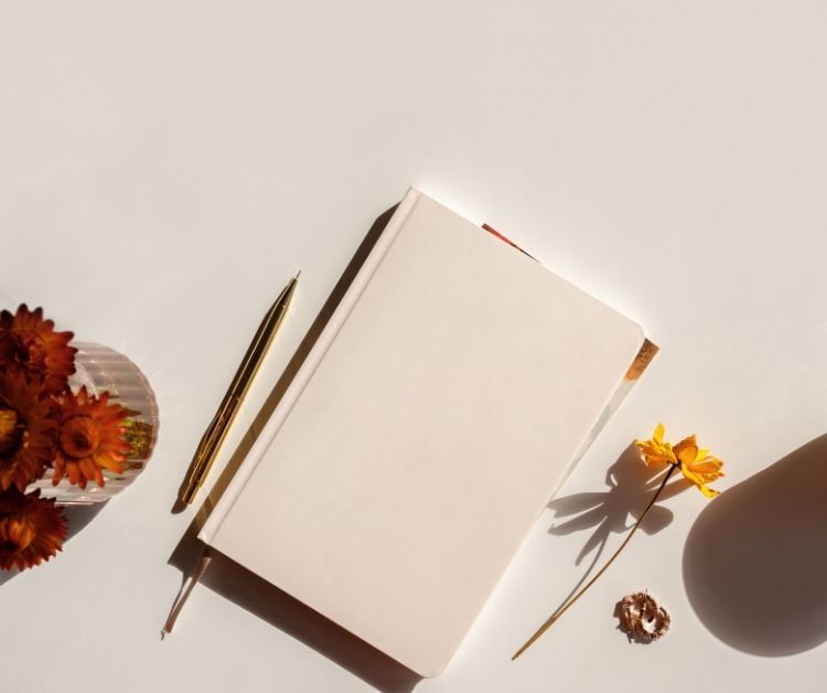 image: a blank journal with a flower
