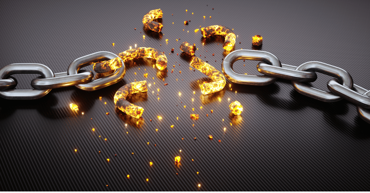 Broken Chains with fire burning pieces of the chain disintegrating