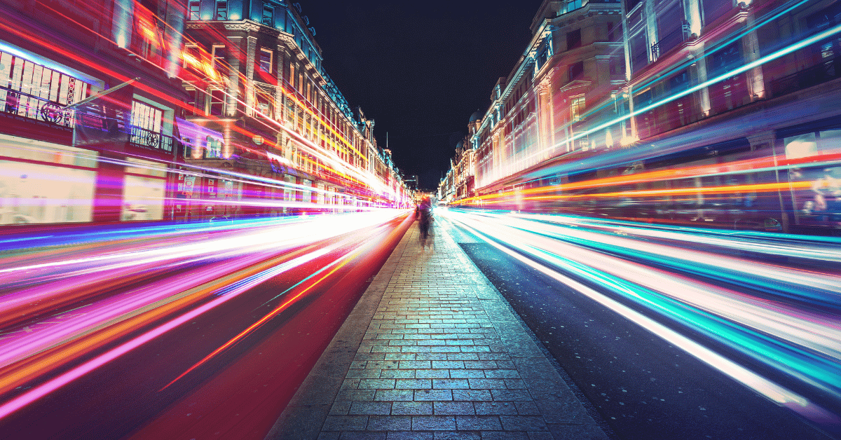 A busy city where its colorful and blurred because of the fast speed