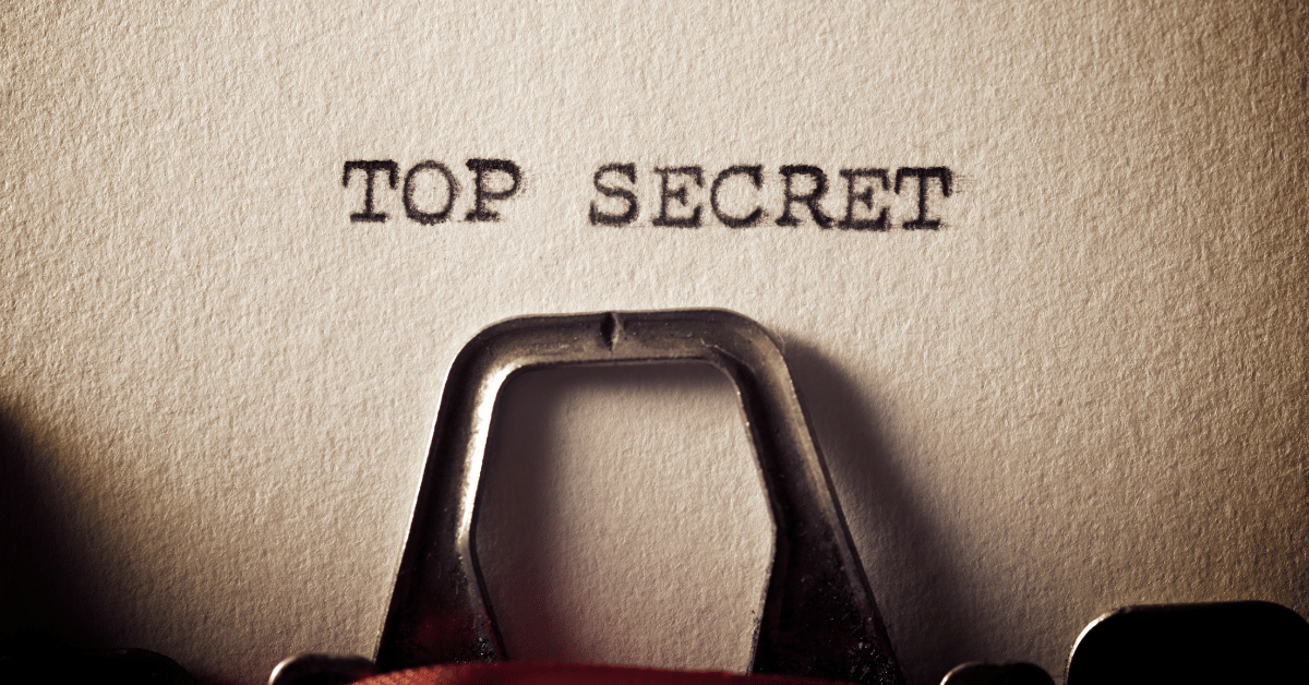 A page in a type write that says "top secret"