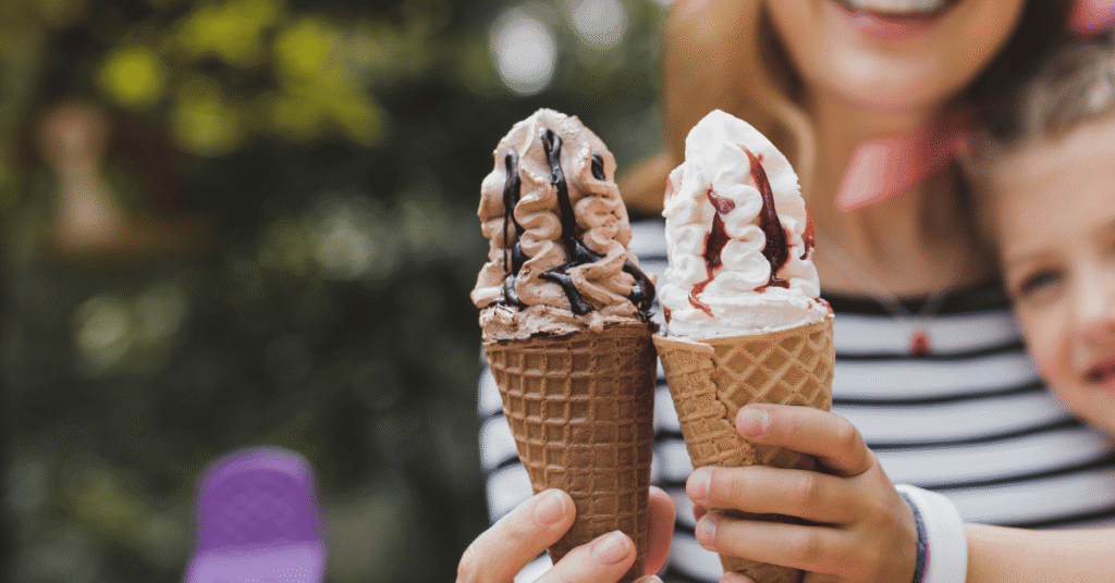 mother and daughter holding cones of ice cream